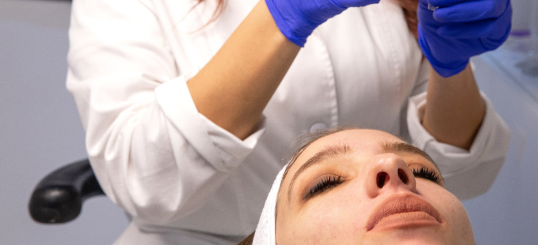 the doctor is doing an aesthetic treatment 