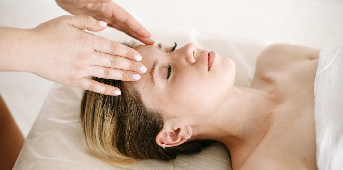 A woman enjoying a facial treatment