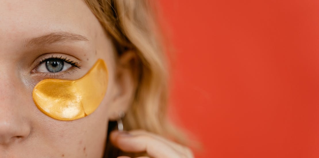 a girl with an under-eye mask