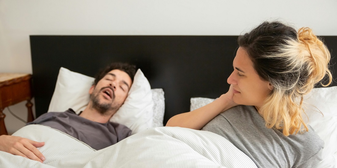 a woman wondering can snoring cause high blood pressure because her husband is snoring loudly 
