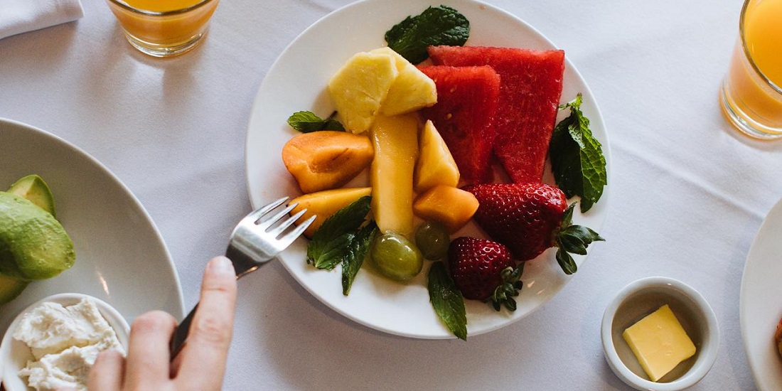 Person eating fruit.