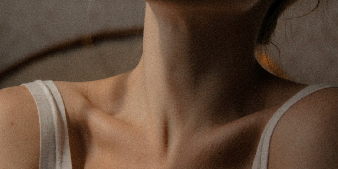Neck of a young woman.