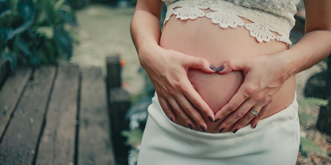 hands of a young woman who needs skin care during pregnancy and breastfeeding