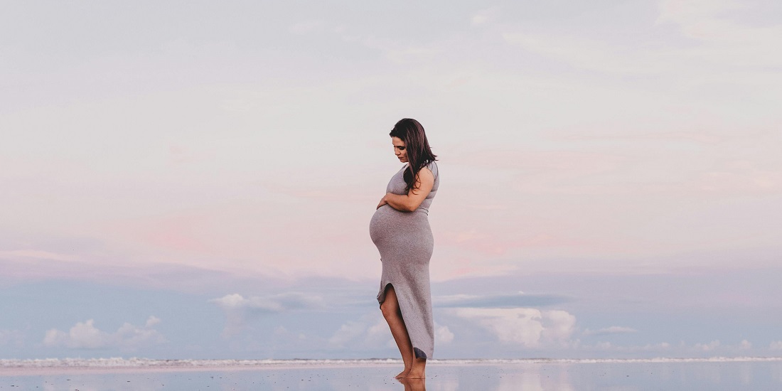 Pregnant woman on the beach