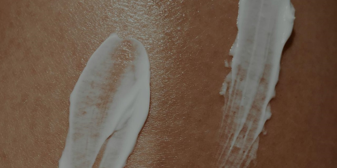 The applied cream helps treat dry eczema on the skin.