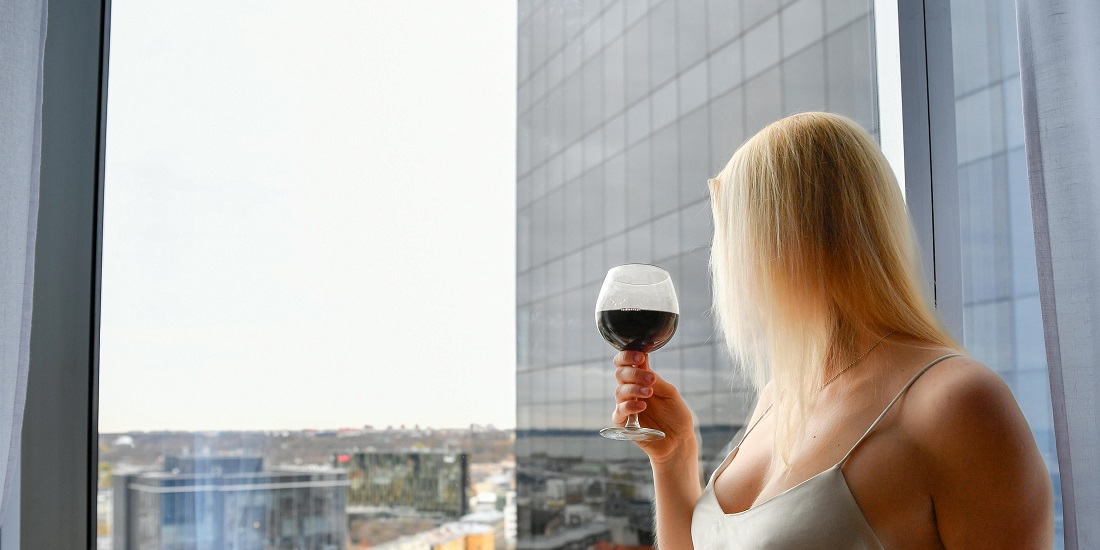 A woman imagines the impact of alcohol on ear function.