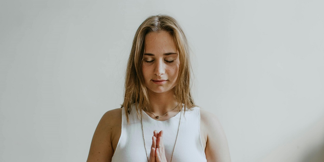 A woman practices breathing techniques.