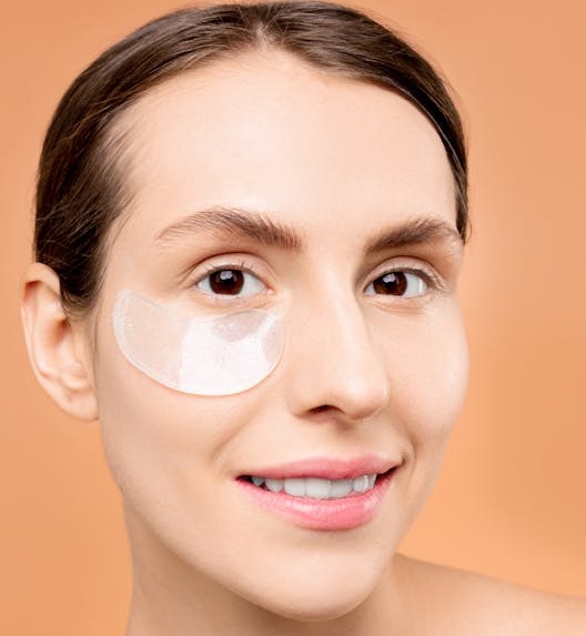 a woman with an under-eye mask