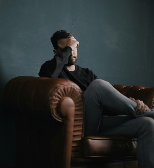 A young man exhausted by daily effort and stress.